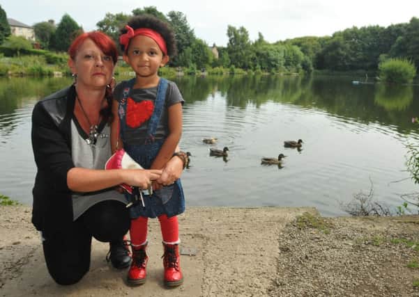 Lorraine Camara with her daughter Masireh (4) at Lowerhouse Lodge where geese and ducks have been dying from avian botulism.