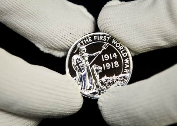 A new £20 silver coin to commemorate one hundred years since the outbreak of the First World War has been produced by the Royal Mint. Photo: Ben Birchall/PA Wire
