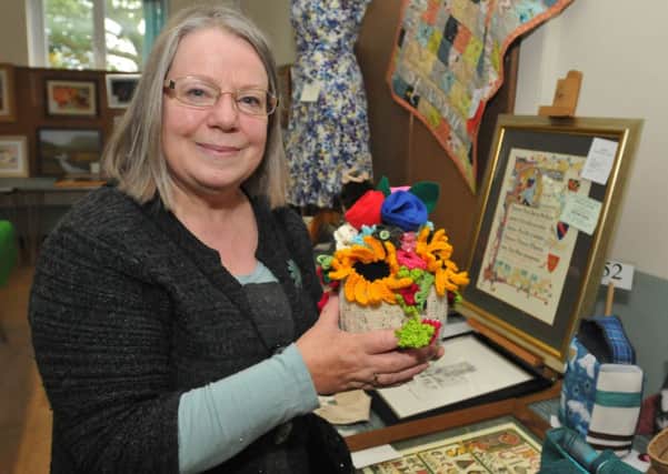 Judge Eleanor Palmer with the handicrafts at the Sabden Show,