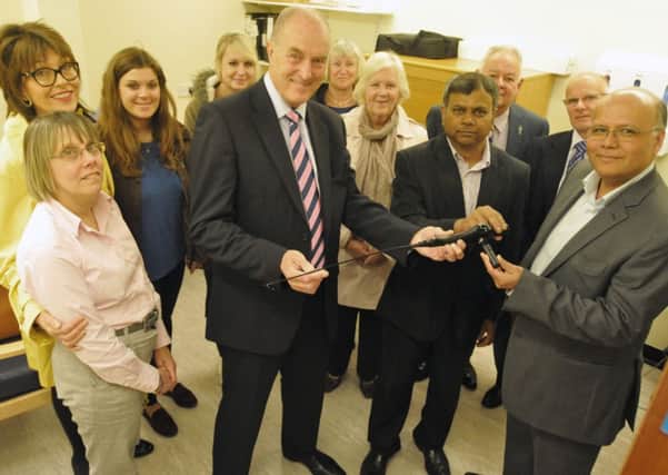 Burnley MP Gordon Birtwistle and his fund-raising team hand over the new  £10,000 scanner which can detect ladies bladder scanner to Mohan Pillai and Shahid Islam at the Urology Unit in Burnley General Hospital.