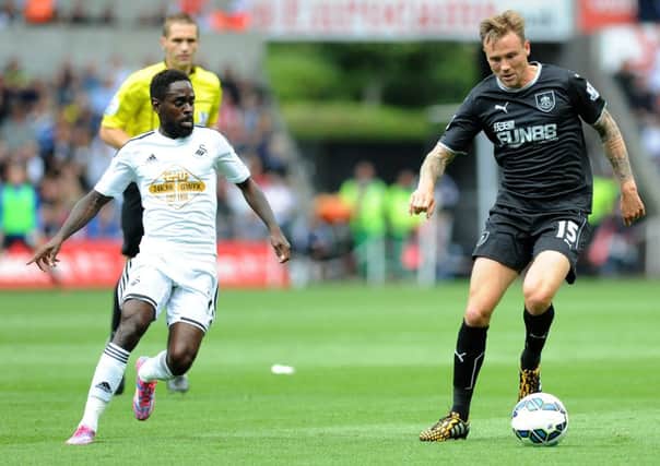 Nathan Dyer vies for possession with Matt Taylor
