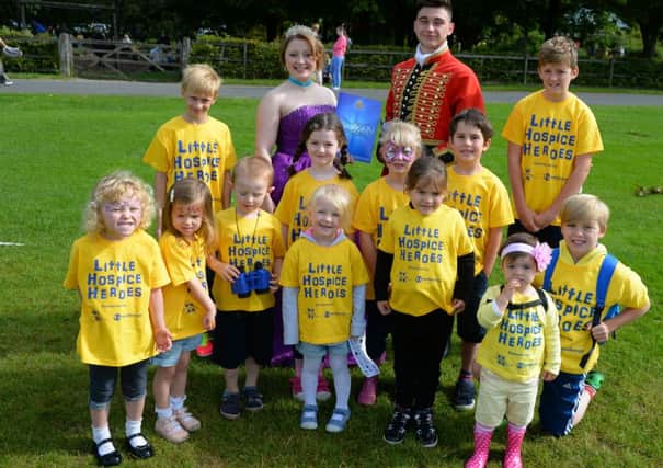 Children pose with Princes Rose and Han,s who led the walk for Little Hospice Heroes in aid of Pendleside Hospice. 
Picture: Paul Currie