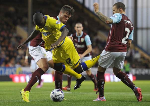 Sheffield Wednesday's Jeremy Helan battles for the ball with Burnley's Kevin Long and Kieran Trippier
