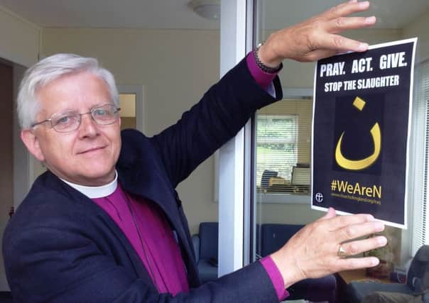 PROTEST: Bishop Julian with the N poster (S)