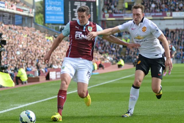 Burnley's Lukas Jutkiewicz vies for possession with Manchester United's Phil Jones

Photographer Chris Vaughan/CameraSport

Football - Barclays Premiership - Burnley v Manchester United - Saturday 30th August 2014 - Turf Moor - Burnley

© CameraSport - 43 Linden Ave. Countesthorpe. Leicester. England. LE8 5PG - Tel: +44 (0) 116 277 4147 - admin@camerasport.com - www.camerasport.com