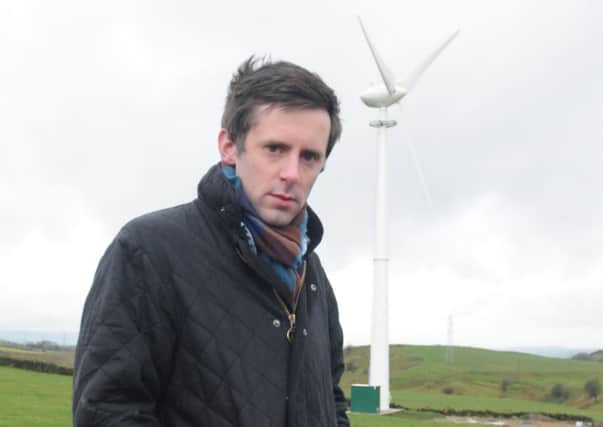 Coun. Paul White with wind turbine