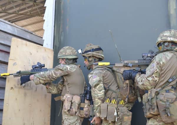 Soldiers in action during the house assault.