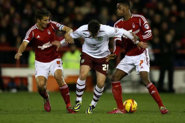 Nottingham Forest's Chris Cohen and Nathaniel Chalobah battle with   Burnley's Keith Treacy during the Sky Bet Championship match at The City Ground, Nottingham. Photo: Mike Egerton/PA Wire.