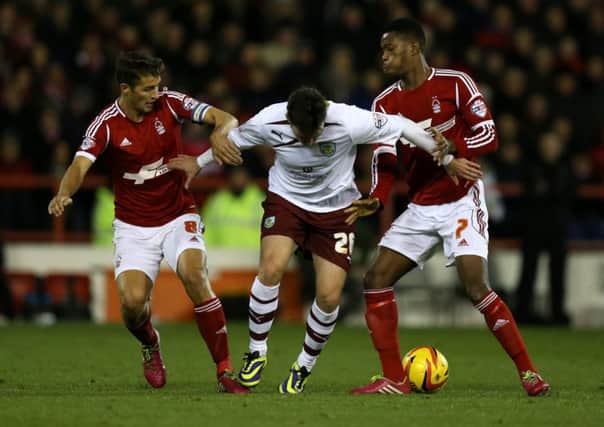 Nottingham Forest's Chris Cohen and Nathaniel Chalobah battle with   Burnley's Keith Treacy during the Sky Bet Championship match at The City Ground, Nottingham. Photo: Mike Egerton/PA Wire.