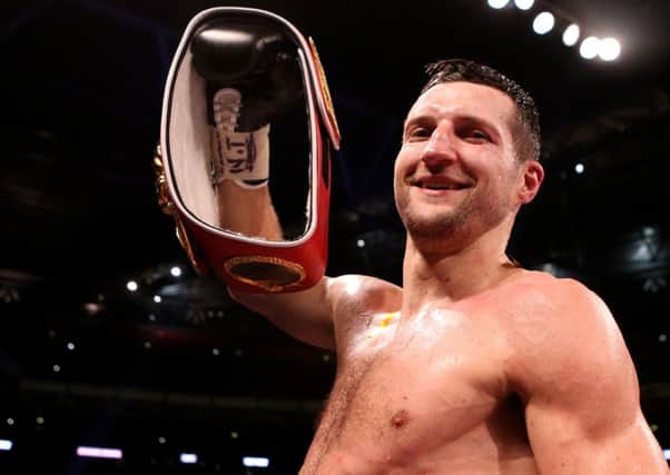 Dine with the champ: Carl Froch celebrates after beating George Groves