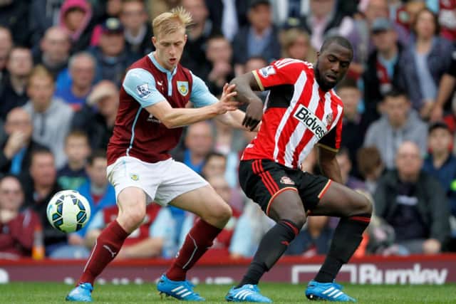 Ben Mee tussles for possession with Sunderland's Jozy Altidore