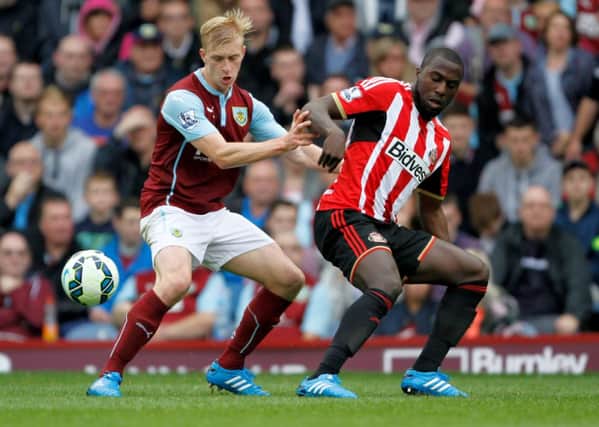 Ben Mee tussles for possession with Sunderland's Jozy Altidore