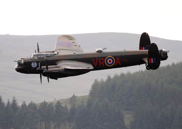 Crowds gathered to watch two Lancaster bombers fly over Derwent Dam in Derbyshire. The RAF BBMF's Lancaster was joined by the Canadian Warplane Heritage Museum's V-RA Lancaster.