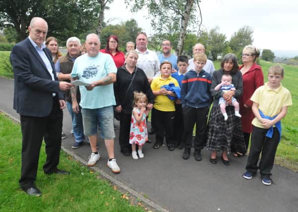 Burnley MP Gordon Birtwistle with Steve Lupton and residents  angry over plans to allow travellers who have set up camp on land in Harold Avenue to stay.