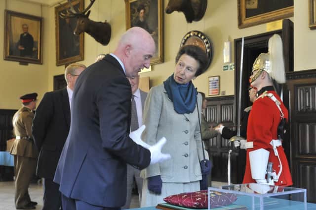 The Princess Royal is shown two of Stonyhursts VC medals by history teacher Paul Garlington. (s)