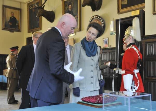The Princess Royal is shown two of Stonyhursts VC medals by history teacher Paul Garlington. (s)