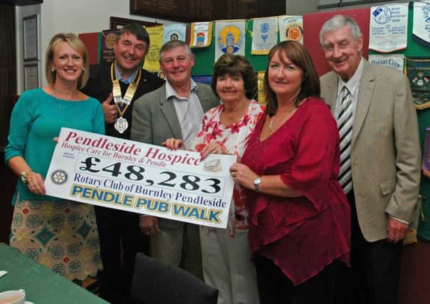 AMAZING TOTAL: Representatives of the Rotary Club of Burnley Pendleside
