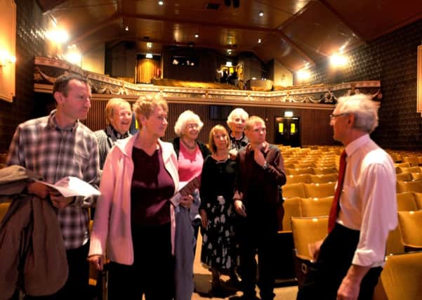 Photo: David Hurst 
Pendle Hippodrome Theatre, Colne, celebrates its 100th anniversay with an open day. 
Vice Chairman Keith Walton discusses the theatre's history with visitors