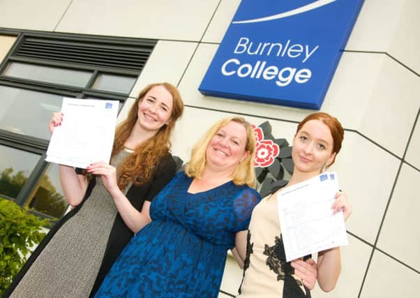 Chloe and Gemma Wilkinson, from Barnoldswick, who excelled in their respective A Level and AS Level exams in the summer, are pictured with proud mum Lizette Jones.