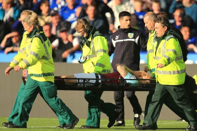 Burnley's Kieran Trippier is carried off on a stretcher during the Barclays Premier League match at the King Power Stadium, Leicester. PRESS ASSOCIATION Photo. Picture date: Saturday October 4, 2014. See PA story SOCCER Leicester. Photo credit should read: Mike Egerton/PA Wire. RESTRICTIONS: Editorial use only. Maximum 45 images during a match. No video emulation or promotion as 'live'. No use in games, competitions, merchandise, betting or single club/player services. No use with unofficial audio, video, data, fixtures or club/league logos.