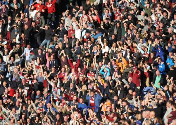 Memorable moment: Burnley fans celebrate Ross Wallaces injury time equaliser last time out at Leicester City