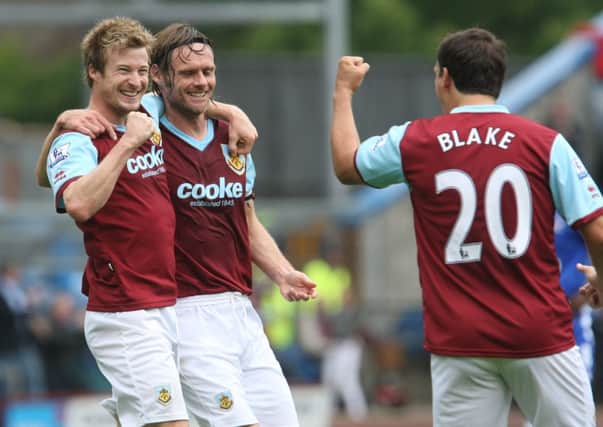 Wade Elliott, Graham Alexander and Robbie Blake celebrate the winning goal against Everton