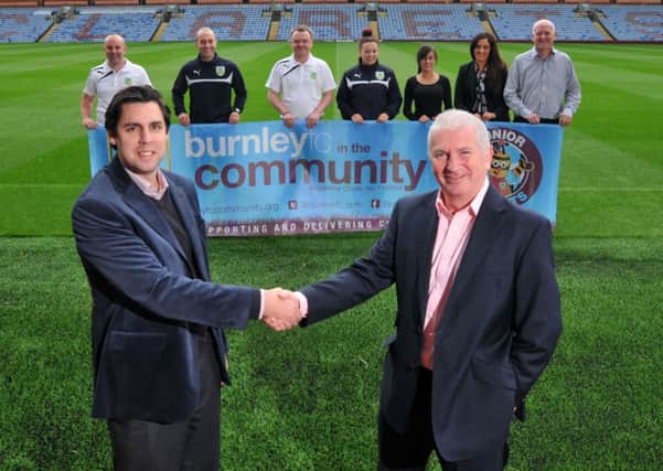 Helping hand: Neil Hart, Head of Community at Burnley Football Club with Donnie Doran of Neville Gee launching the employability course