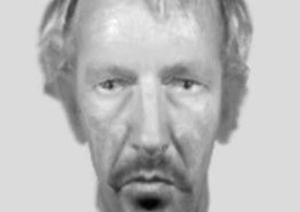 An e-fit of a man police want to speak to after a member of rail staff was racially abused and threatened.
