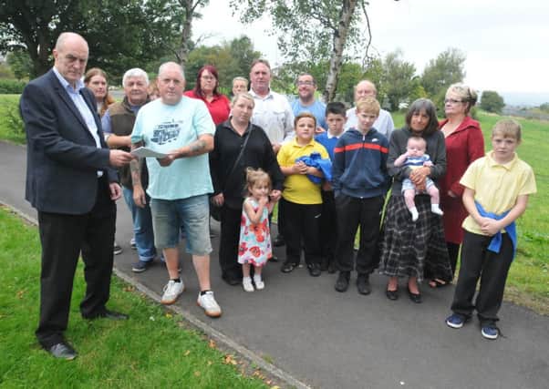 Burnley MP Gordon Birtwistle with Steve Lupton and local residents who are angry over plans to allow the travellers who have set up camp on land on Harold Avenue to stay.