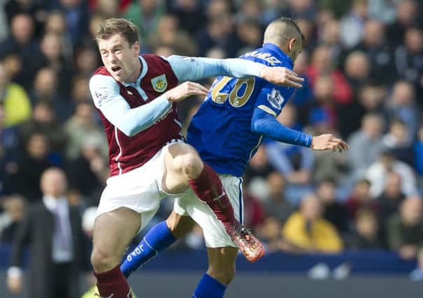 Clarets striker Ashley Barnes tussles with Leicester Citys Riyad Mahrez during his only league start of the campaign