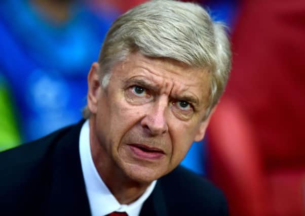 Arsenal manager Arsene Wenger before the UEFA Champions League Qualifying Play Off, second leg match at the Emirates Stadium, London. PRESS ASSOCIATION Photo. Picture date: Wednesday August 27, 2014. See PA story SOCCER Arsenal. Photo credit should read: Adam Davy/PA Wire.