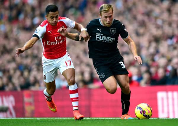 Birthday boy: Scott Arfield battles with Arsenals Alexis Sanchez on his 26th birthday at the Emirates Stadium on Saturday