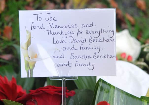 A floral tribute from David Beckham and family at the funeral of Joe Brown.