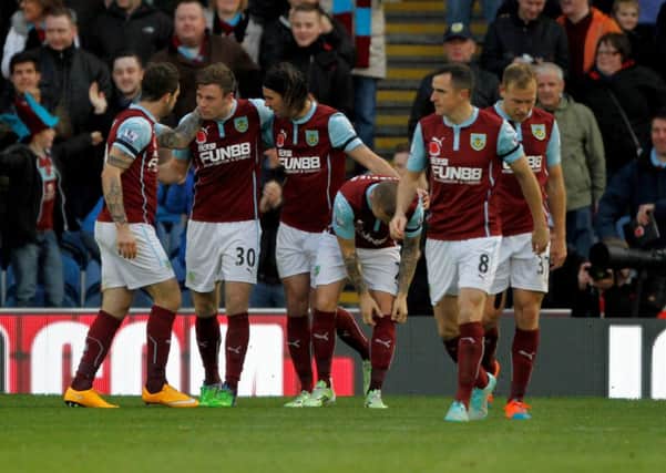 Burnley's Danny Ings and team celebrate the only goal of the game with goalscorer Burnley's Ashley Barnes