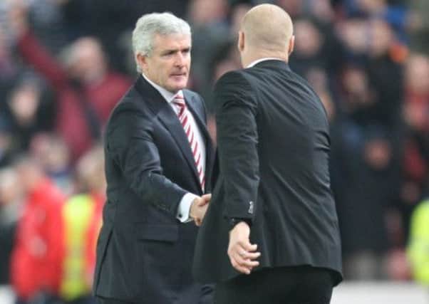 Stoke City manager Mark Hughes  (L) and Burnley manager Sean Dyche shake hands at the final whistle

Photographer Jack Phillips/CameraSport

Football - Barclays Premiership - Stoke City v Burnley  - Saturday 22nd November 2014 - Britannia Stadium - Stoke

© CameraSport - 43 Linden Ave. Countesthorpe. Leicester. England. LE8 5PG - Tel: +44 (0) 116 277 4147 - admin@camerasport.com - www.camerasport.com