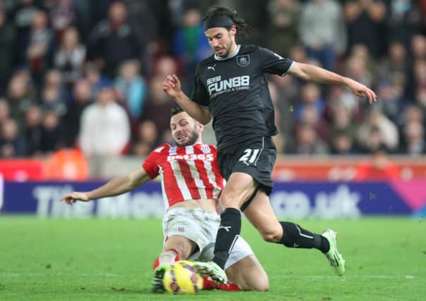 George Boyd tries to escape the attention of Stoke's Phil Bardsley