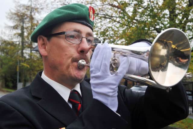 Peter Webster from the charity Veterans in the Community, plays the Last Post at the service to commemorate the new war memorial outside St Peter's Church, Simonstone.