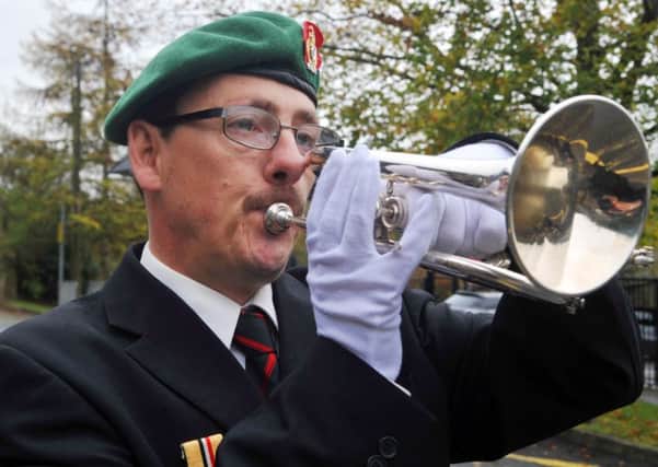 Peter Webster from the charity Veterans in the Community, plays the Last Post at the service to commemorate the new war memorial outside St Peter's Church, Simonstone.