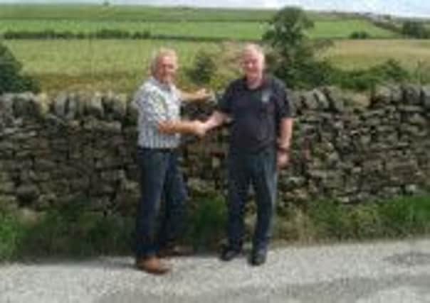 Ron Thompson (right), partner and large animal vet for Stanley House Vets with Trawden Show vice-chairman Sean Hickey (S)