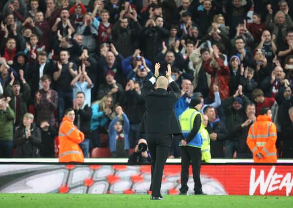 Sean Dyche salutes the Burnley fans after the victory over Stoke