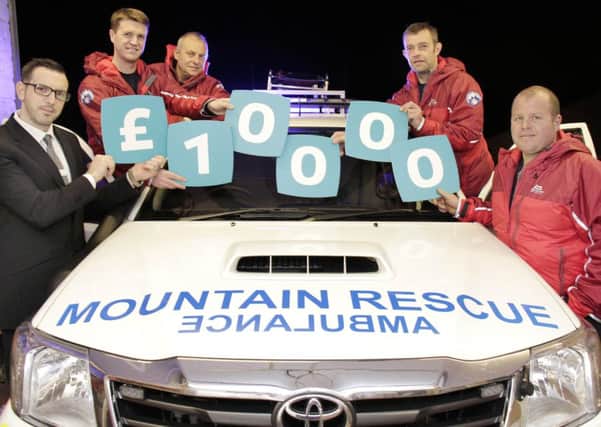 Yorkshire Building Society branch manager David Marshall with members of the Rossendale & Pendle Mountain Rescue Team