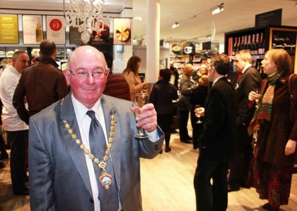 Barrowford Parish Council chairman James Begley celebrating the new Booths store