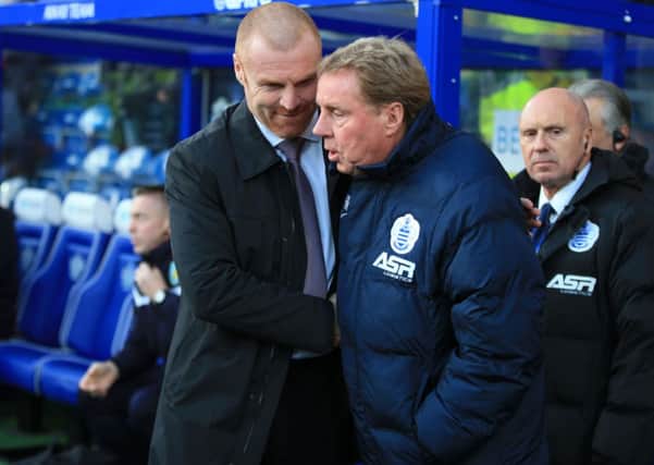 Burnley manager Sean Dyche and Queens Park Rangers manager Harry Redknapp meet prior to the Barclays Premier League match at Loftus Road, London. PRESS ASSOCIATION Photo. Picture date: Saturday December 6, 2014. See PA story SOCCER QPR. Photo credit should read: Nick Potts/PA Wire. Editorial use only. Maximum 45 images during a match. No video emulation or promotion as 'live'. No use in games, competitions, merchandise, betting or single club/player services. No use with unofficial audio, video, data, fixtures or club/league logos.