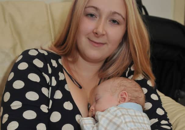 Abbie Stockwell with her 10-week-old son Eric who is campaigning for breastfeeding to be normalised.