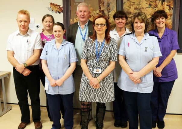 Dr Dan Ibbotson and Dr Victoria Gauge from Castle Medical Group pictured with ELHT Divisional General Manager Catriona Logan (front), Divisional Clinical Director Dr Alan Crowther and staff from Ribblesdale Ward.