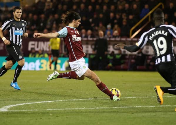 Burnley's George Boyd scores during the Barclays Premier League match at Turf Moor, Burnley. Photo: Lynne Cameron/PA Wire.