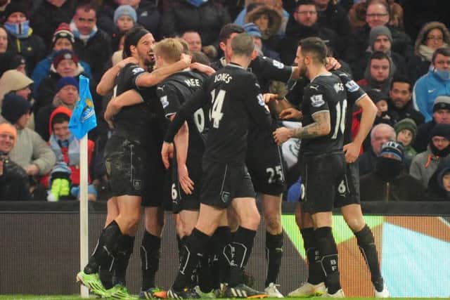 Burnley players celebrate Ashley Barnes' equaliser