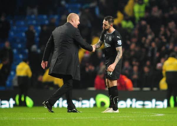 Burnley manager Sean Dyche, left, shakes hands with Burnley's Danny Ings at the end of the game 

 - Manchester City v Burnley. Photo: CameraSport