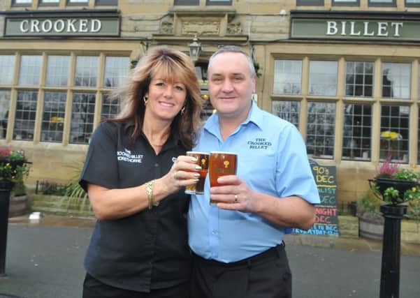 Alison Leigh and Paul Miller from the Crooked Billet celebrate being voted the best bar in Burnley.