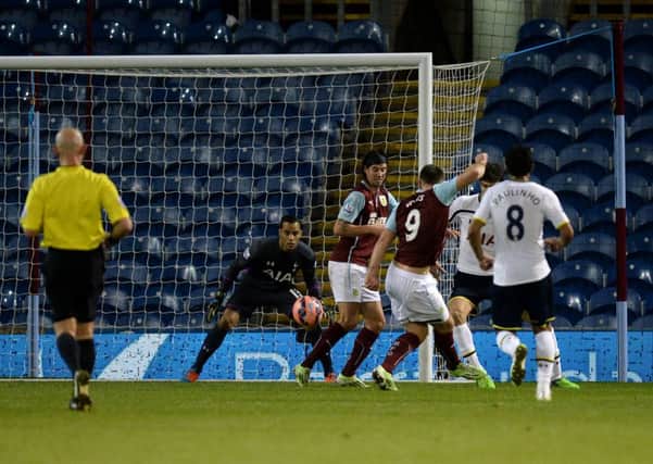 Burnley's Sam Vokes scores his sides first goal of the game during the FA Cup, Third Round match at Turf Moor, Burnley. PRESS ASSOCIATION Photo. Picture date: Monday January 5, 2015. See PA story SOCCER Burnley. Photo credit should read: Martin Rickett/PA Wire. RESTRICTIONS: Editorial use only. Maximum 45 images during a match. No video emulation or promotion as 'live'. No use in games, competitions, merchandise, betting or single club/player services. No use with unofficial audio, video, data, fixtures or club/league logos.